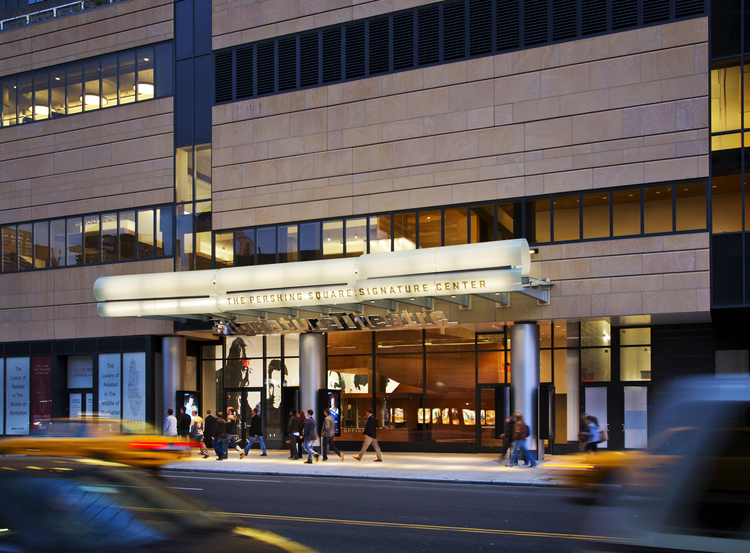 A night time view of the Pershing Square Signature Center building.